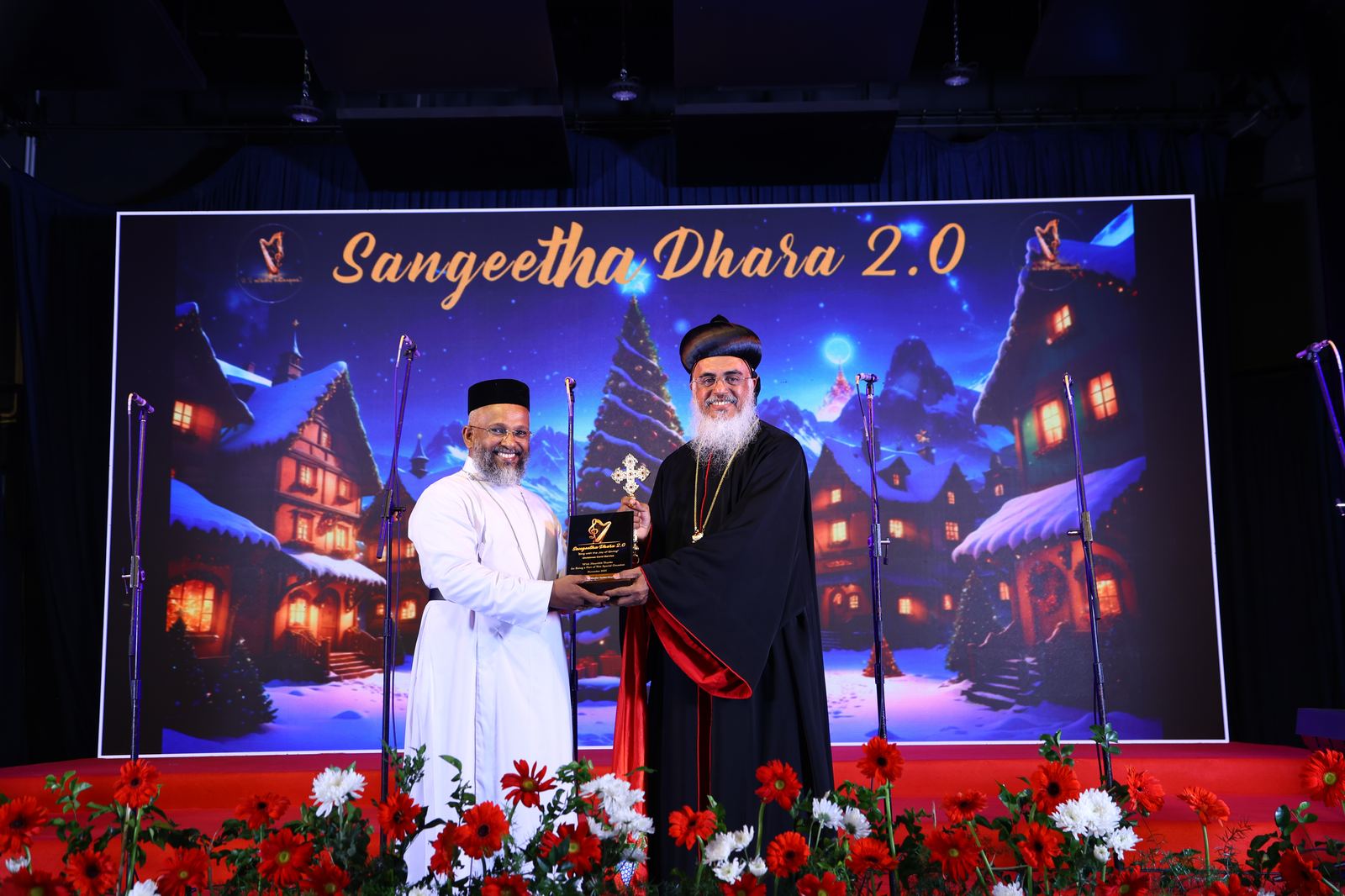 Sangeetha Dhara 2.0 — dignitaries on stage with a memento