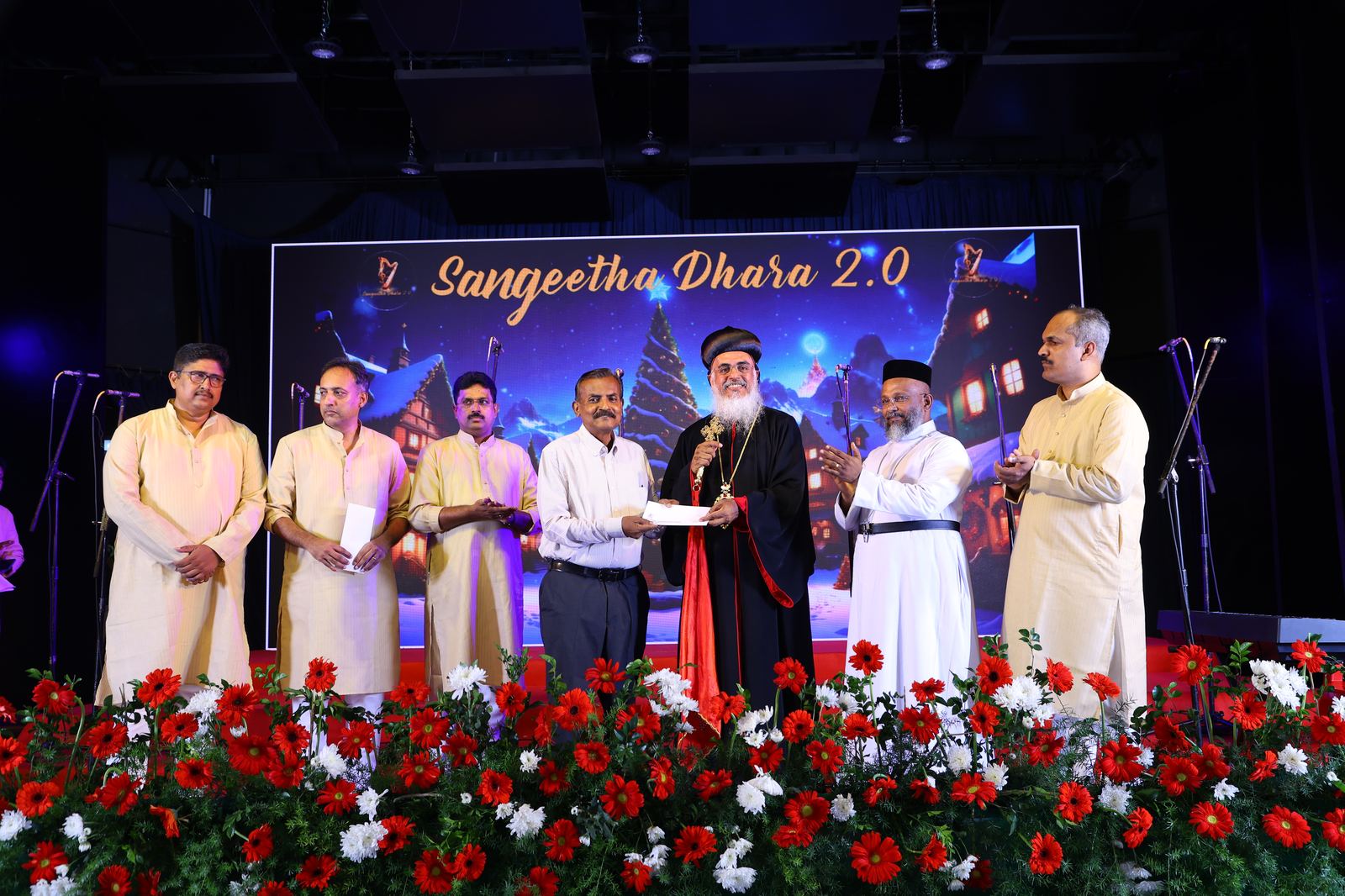 Sangeetha Dhara 2.0 — presenting a memento to a guest
